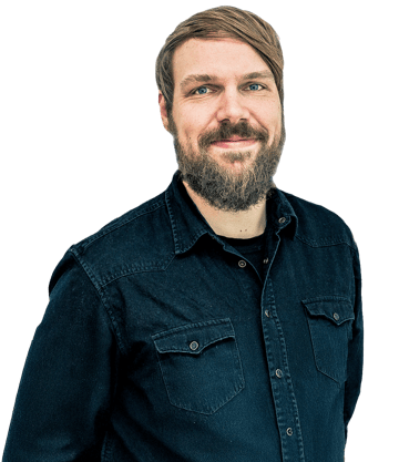 One person is wearing a dark blue denim shirt with pockets and studded buttons.